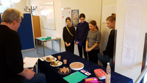 The winning team present their lunchbox 